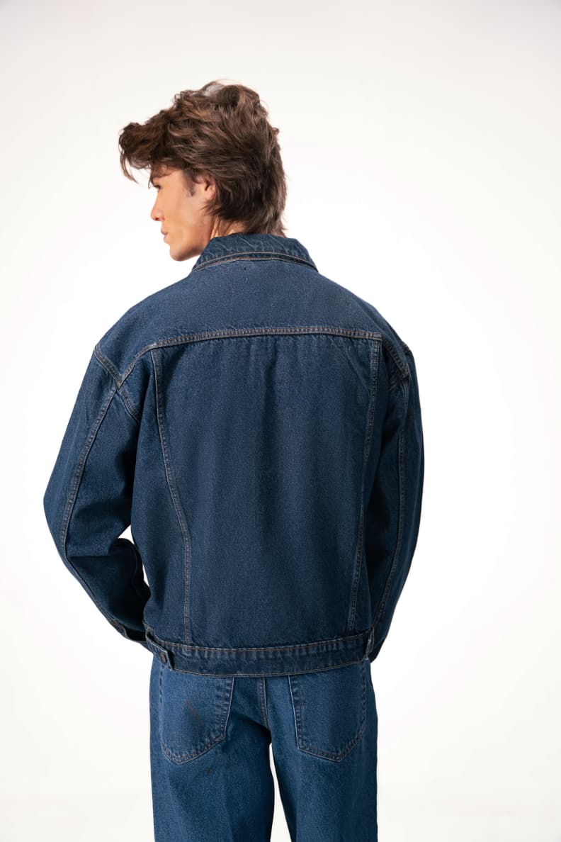 Back View Of Denim Jacket Worn By Male Model