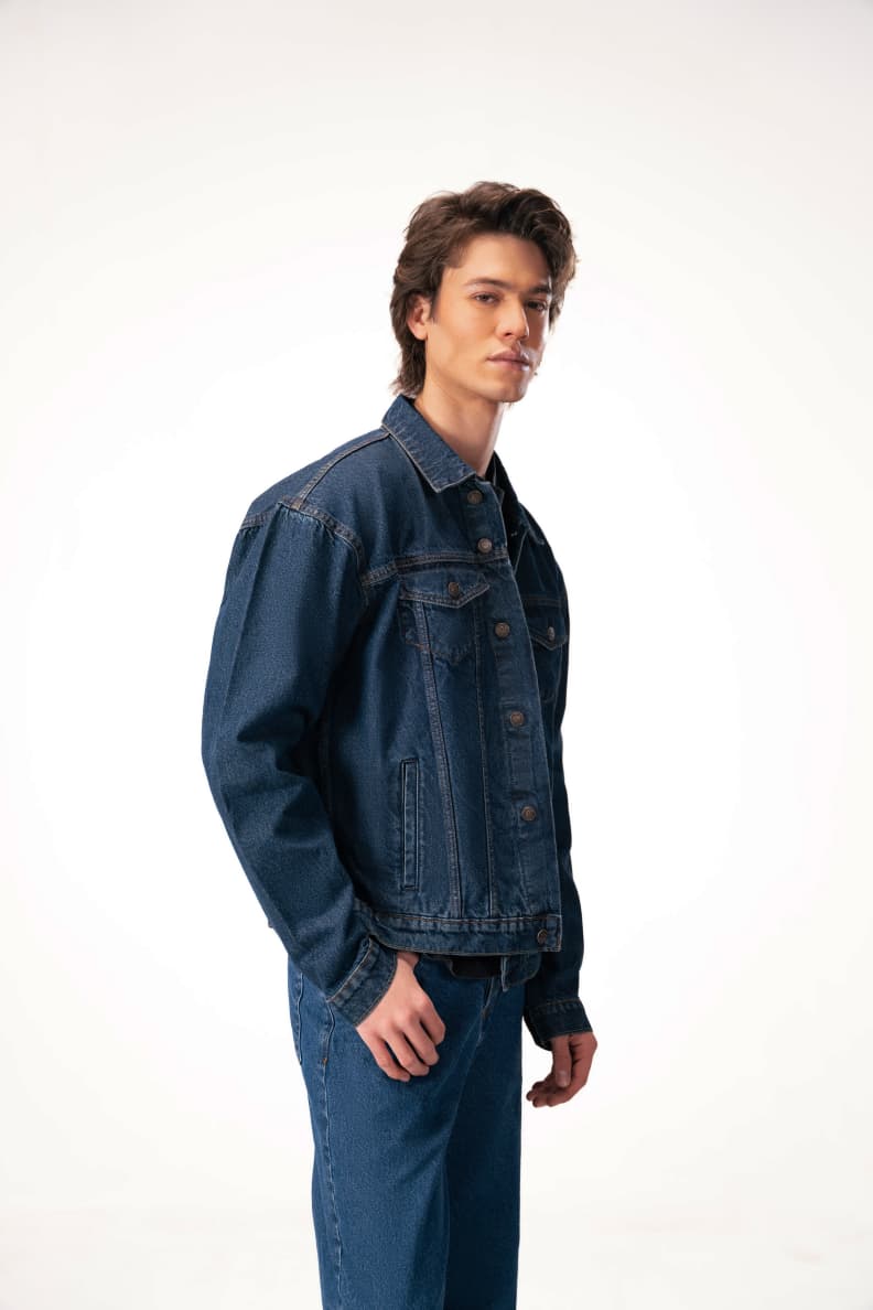 Side View Of Male Model Wearing Denim Jacket