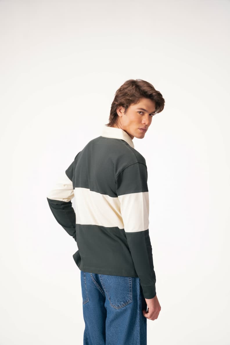 Back view of man wearing green rugby shirt Scarab/Cannoli Cream