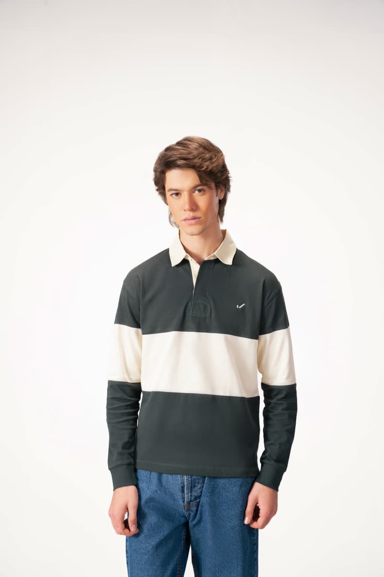 Man wearing green and cream rugby shirt front pose Scarab/Cannoli Cream