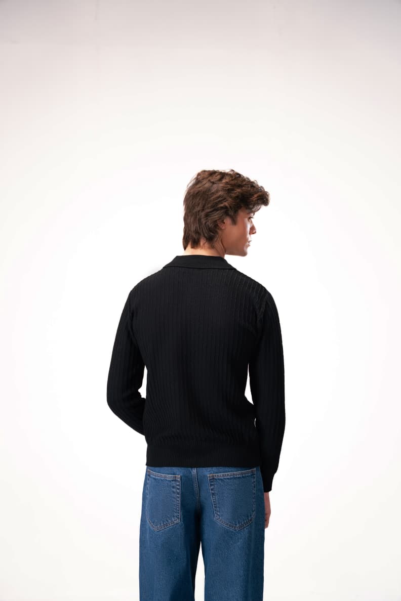 Model turned slightly showing back view of sweater Black JADE