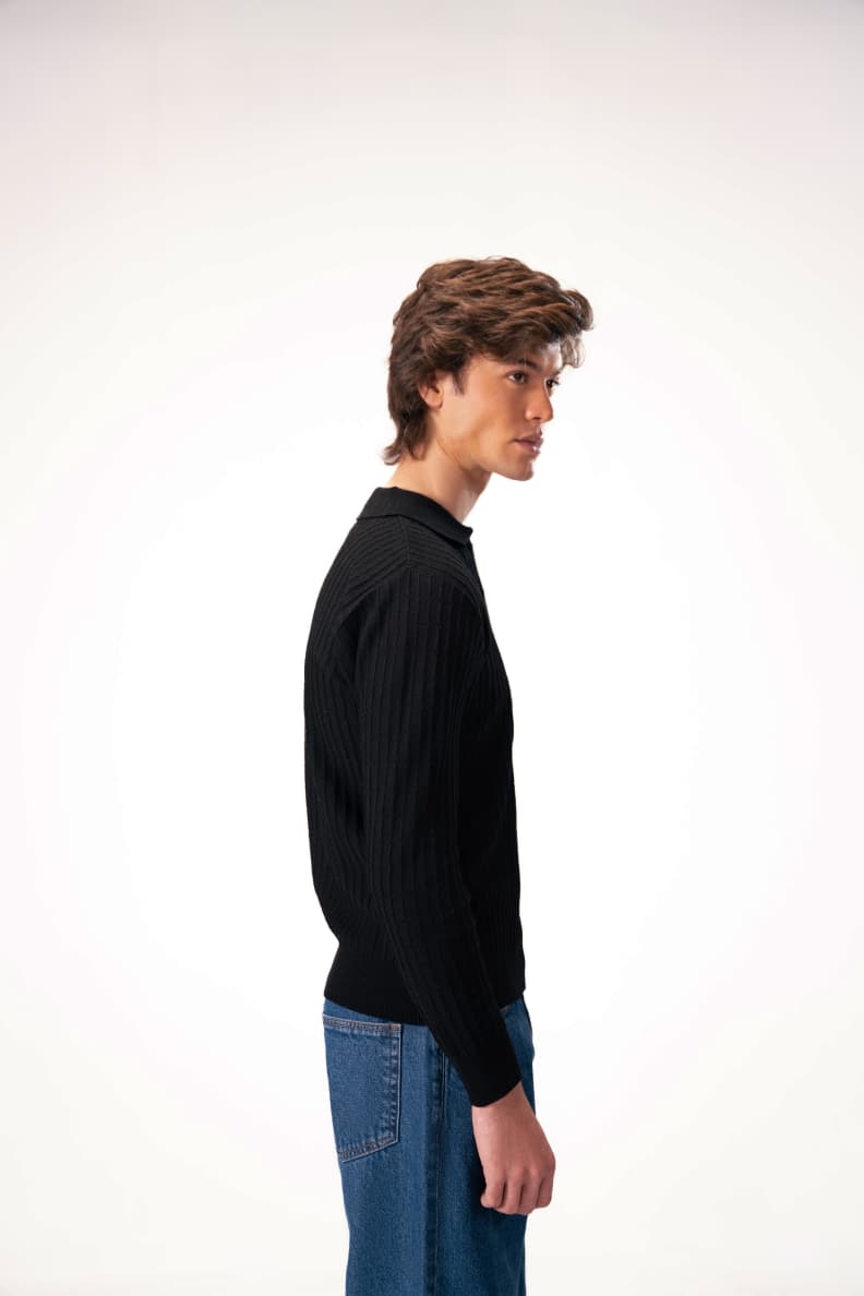 Side profile of model in black knit sweater Black JADE