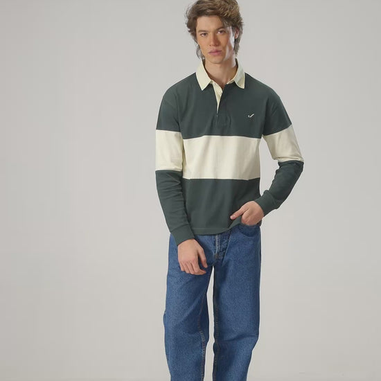 Full body view of man in green rugby shirt Scarab/Cannoli Cream